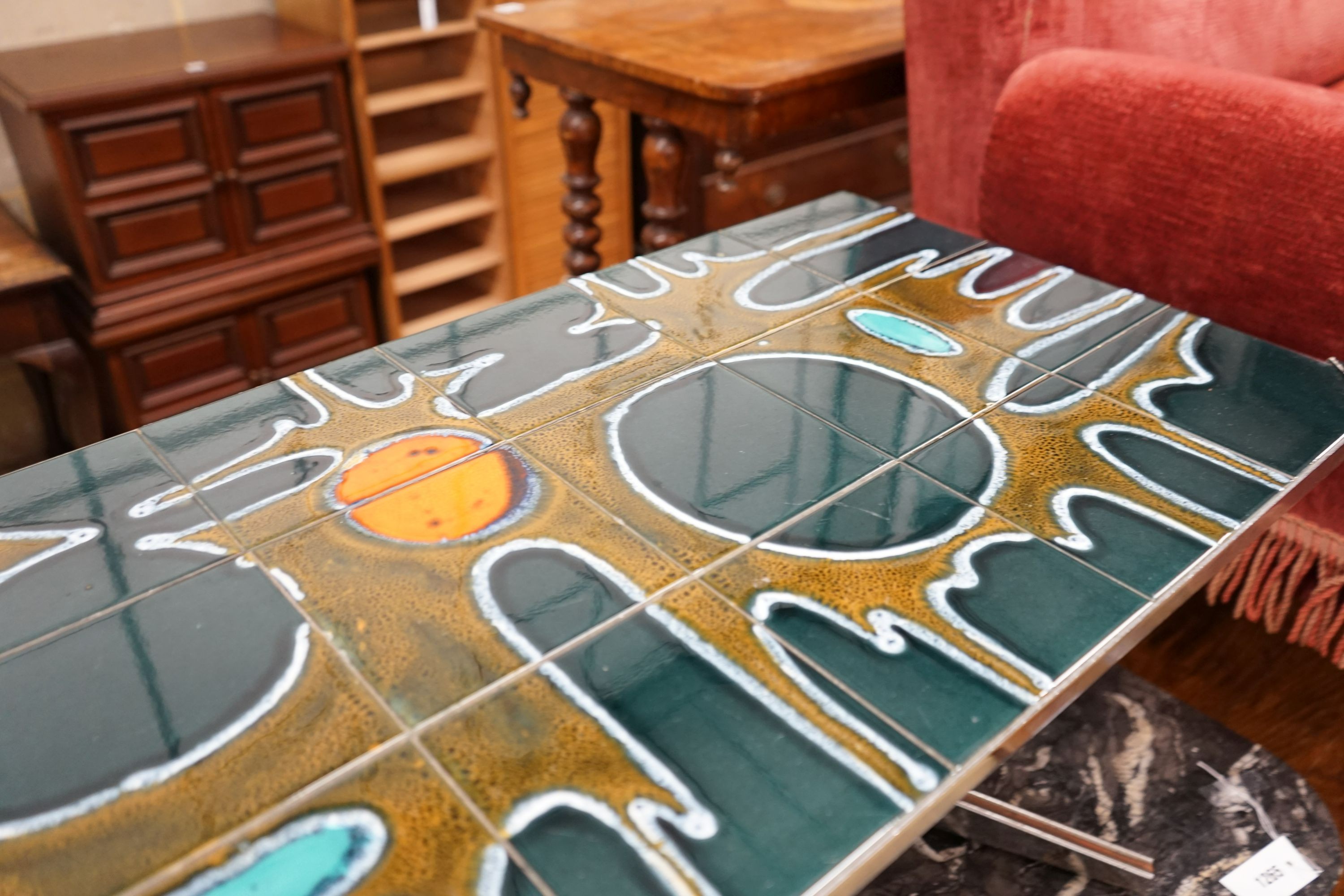 A mid century design tile topped rectangular chrome coffee table, length 121cm, depth 46cm, height 41cm